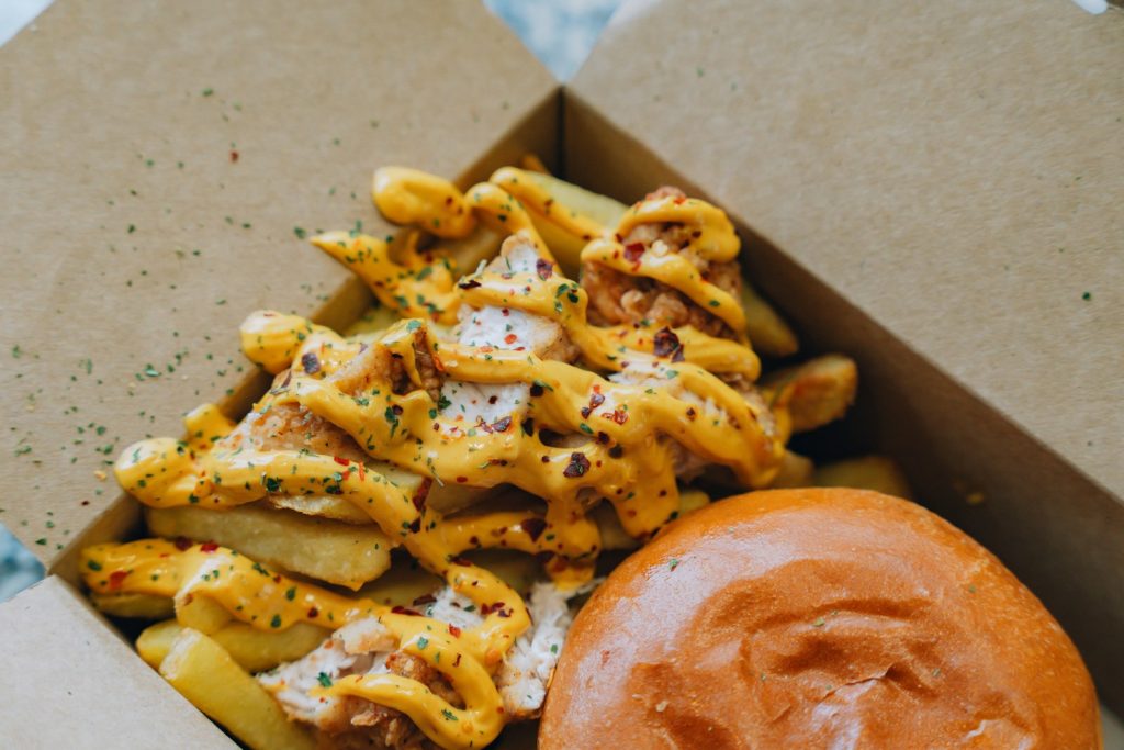 Fries and a burger are shown in a box.